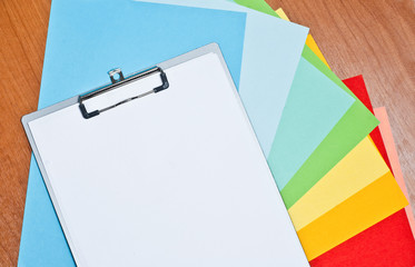 Folder and sheets of colored paper