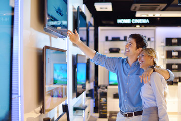 Young couple in consumer electronics store