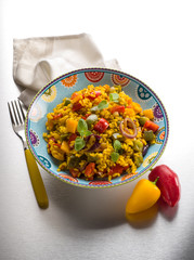 risotto with saffron and capsicum over steel background