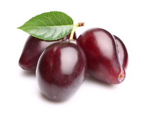 Juicy plums with leaf