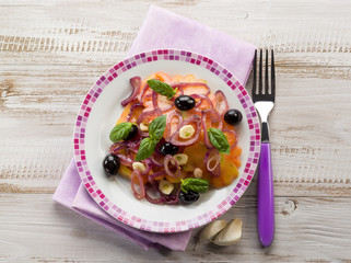 salad with ox heart tomatoes, onions olives and garlic
