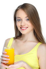 Portrait of a young woman with glass of juice on a white