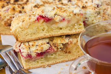Slices of cake with raspberries, apples and crisp