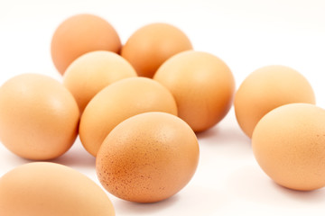 Brown eggs on a white background