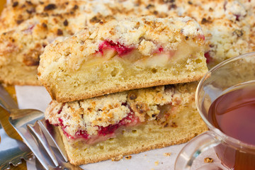 Slices of cake with raspberries, apples and crisp