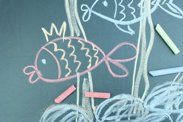 Two fishes, сhild's drawing with chalk