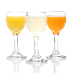 Tropical juices in glasses isolated on white