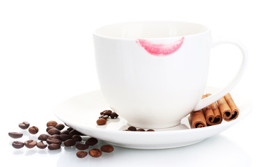 cup of coffee with lipstick mark beans and cinnamon sticks