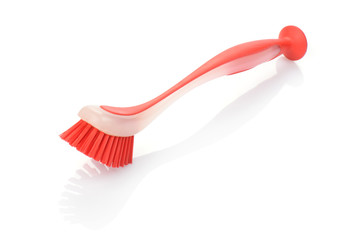 red crockery brush isolated on white