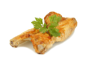 roasted chicken wings with parsley isolated on white