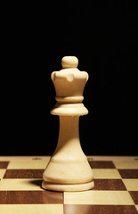 Chess board with chess piece isolated on black