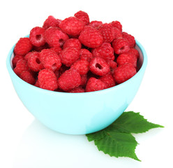 Fresh raspberries in colorful bowl isolated on white