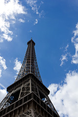 Eiffel Tower against blue clouded sky