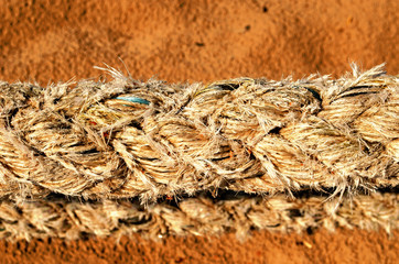 thick synthetic rope and sea sand on background