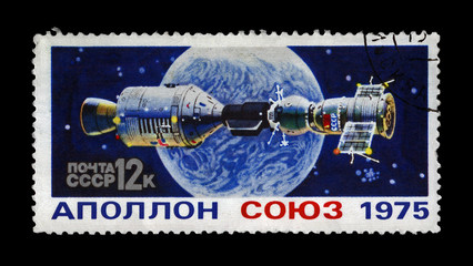 experimental flight of Soyuz and Apollo spaceship,circa 1975. manned space flight near Earth Planet. Apollo-Soyuz Test Project as 1st joint flight of the USA and USSR.  Stamp printed in USSR (Russia).