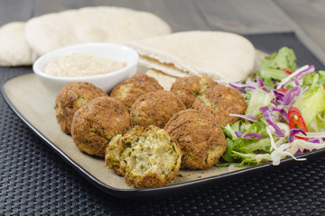 Falafel - Deep fried chickpeas balls with tahini, salad & pitta
