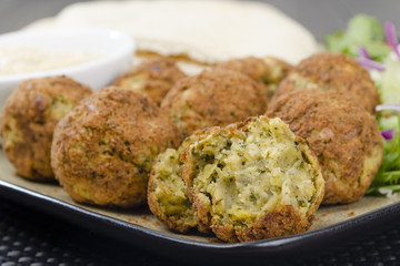 Falafel - Deep fried chickpeas balls with tahini, salad & pitta