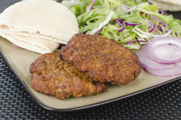 Shami Kebab - Spicy lamb patties, salad, pitta & red onions