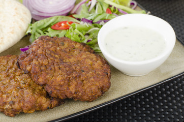 Shami Kebab - Spicy lamb patties mint raita, salad & pitta