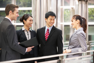 Four Business Colleagues Having Discussion Outside Office