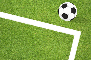 Football soccer on grass background