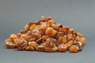 Raisins on a gray background