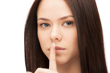 picture of woman with finger on lips