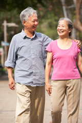 Obraz premium Senior Chinese Couple Walking In Park