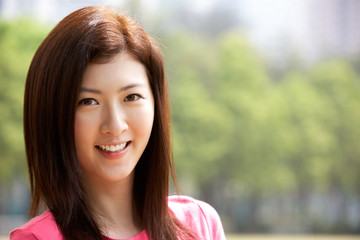 Head And Shoulders Portrait Of Attractive Chinese Woman