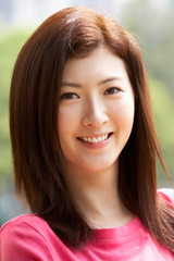 Fototapeta premium Head And Shoulders Portrait Of Attractive Chinese Woman