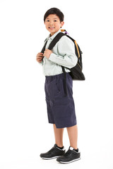 Studio Shot Of Chinese Boy In School Uniform