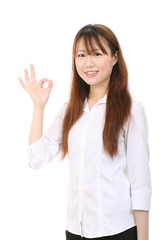 Young asian businesswoman with okay gesture