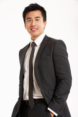 Studio Portrait Of Chinese Businessman