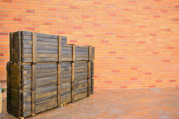 modern brick wall background with old wooden boxes