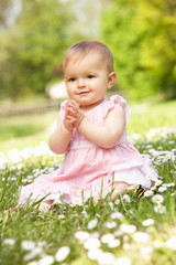 Baby Girl In Summer Dress Sitting In Field
