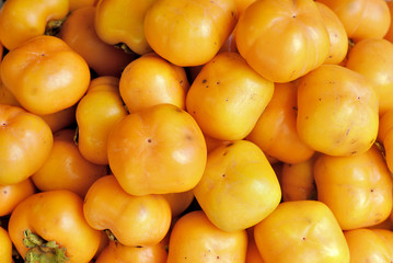 Persimmons, groups of orange color fruit