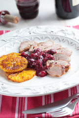 Duck meat with orange and cherry sauce