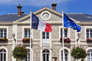 Town hall in Etretat - French seaside resort. - obrazy, fototapety, plakaty