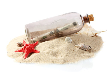 Glass bottle with note inside on sand isolated on white