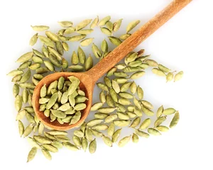 Poster green cardamom in wooden spoon on white background close-up © Africa Studio
