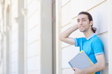 Student outside preparing for exams