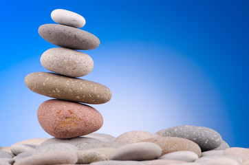 Pebbles stack against gradient background