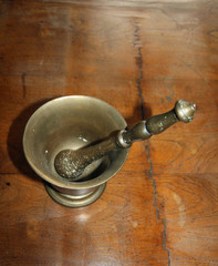 mortar and pestle to crush the Officinal herbs