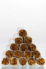 Close up of a smoking cigarettes in a stack