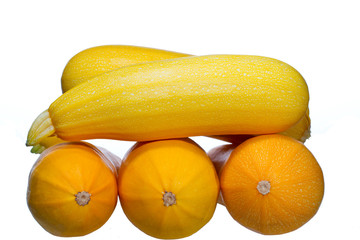 Yellow courgettes on white background