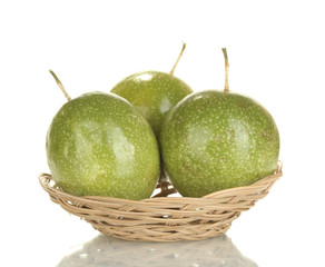 three green passion fruit isolated on white