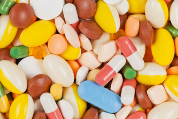 Medicine pills and capsules forming a background