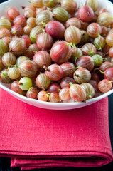 Glass bowl full of gooseberries, close-up