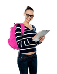 Female student playing on touch screen device