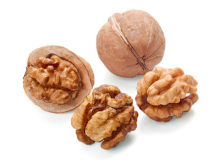 walnut and a cracked walnut isolated on the white background